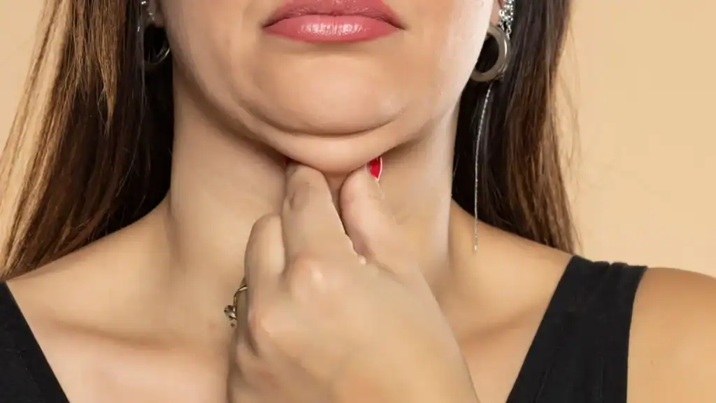 An image of a woman with double chin, sad, worried : Non Surgical Double Chin Removal Treatment in Hounslow, UK